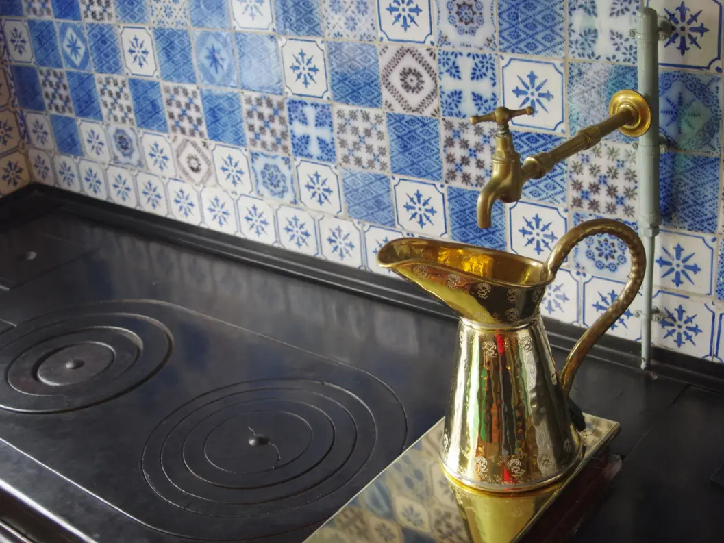 It combines bold colors, intricate patterns, and traditional craftsmanship to create a warm and lively atmosphere. Material such as clay, rock, and travertine are often used.